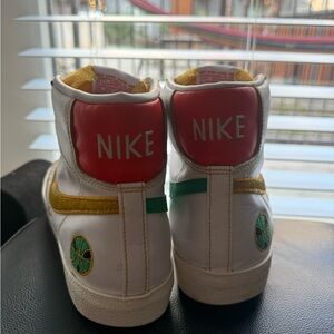 Nike White High-Top Sneakers with Red, Yellow and Green Accents